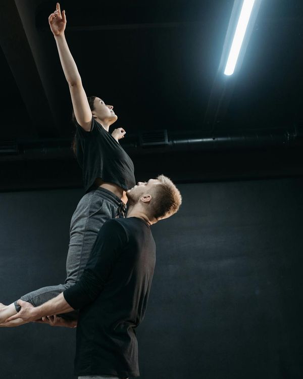 Abstract representation of energy flow and body flexibility.